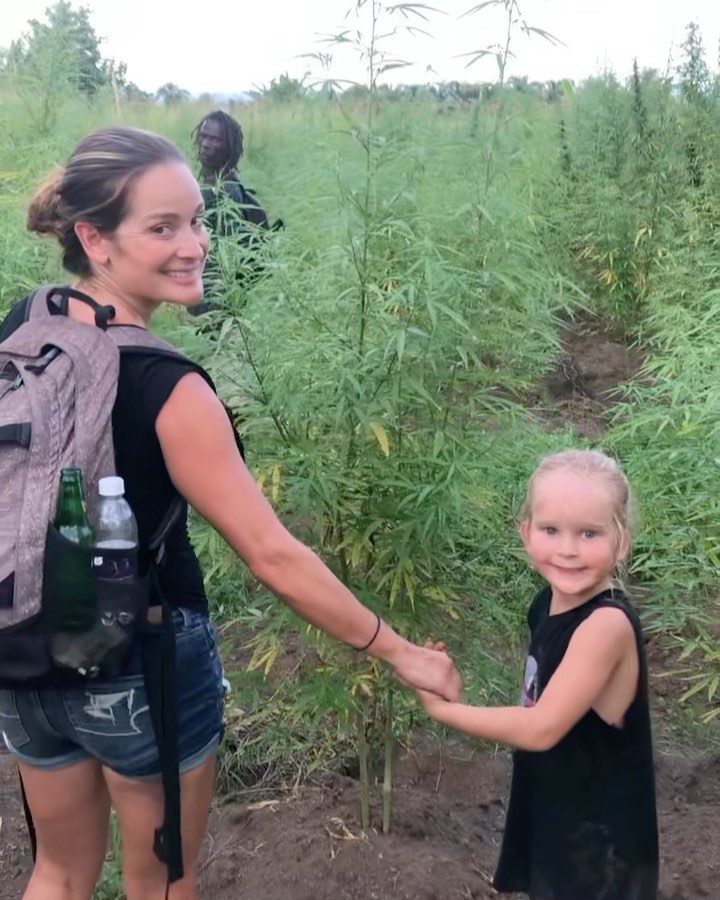 Here’s to all the Mamas out there raising a post-prohibition generation.🥂(Our CEO @aprilarrasate and her son visiting with a generational cannabis farmer in St. Vincent.️)